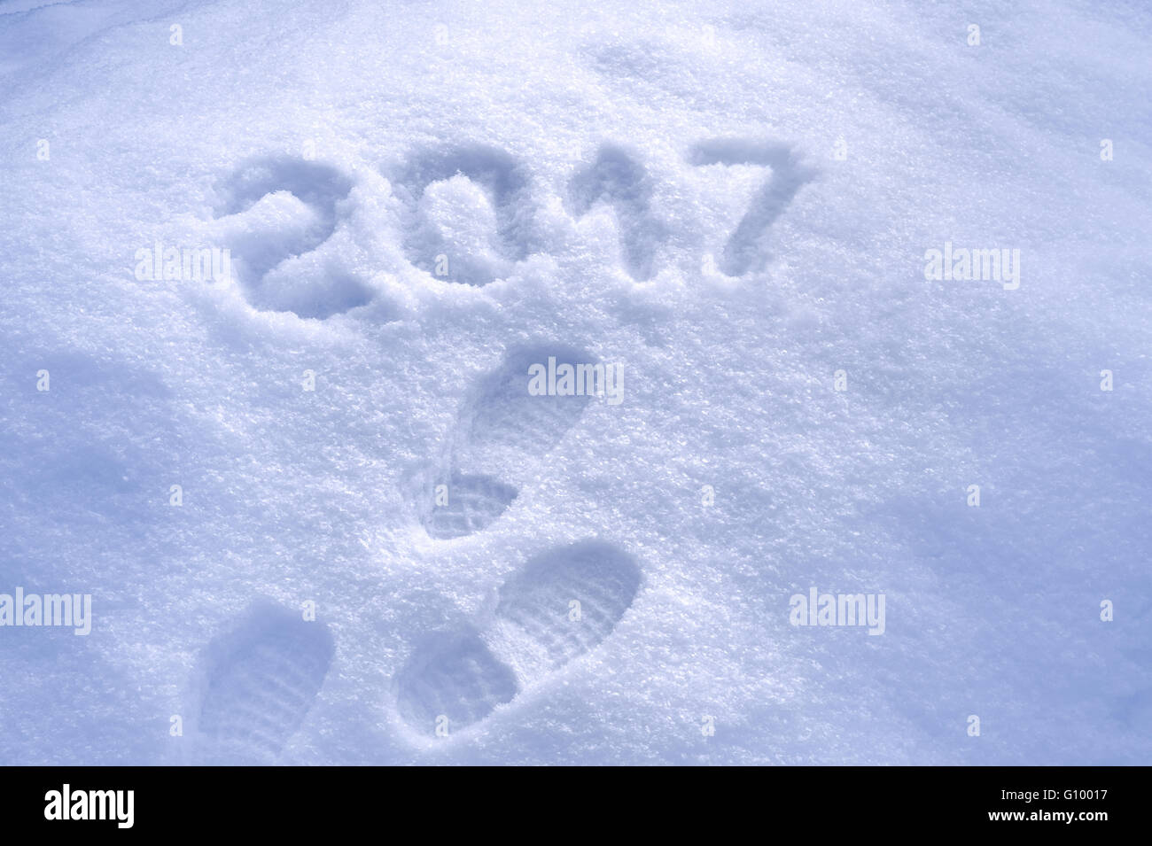 2017 New Year, 2017 New Year greeting card, Foot step prints in snow, foot steps, shoe prints in snow Stock Photo