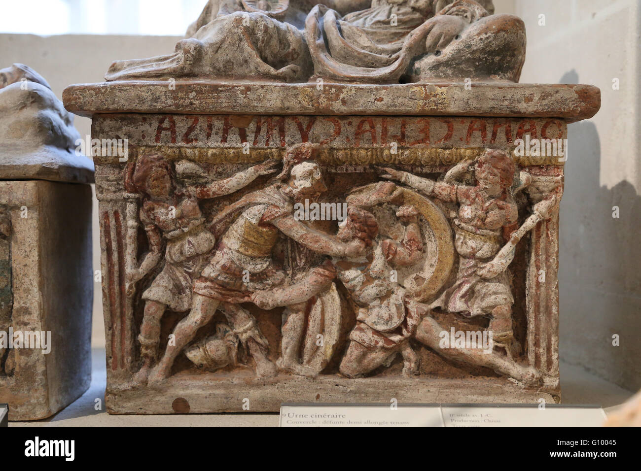 Etruscan cinerary urn with Eteocles and Polyneices (duel of the brothers) and Furies. 2nd century BC. Terracotta. Louvre Museum. Stock Photo