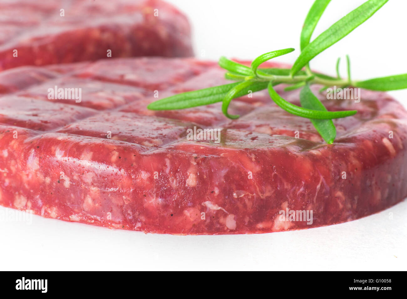 Raw beef hamburger isolated on white background Stock Photo