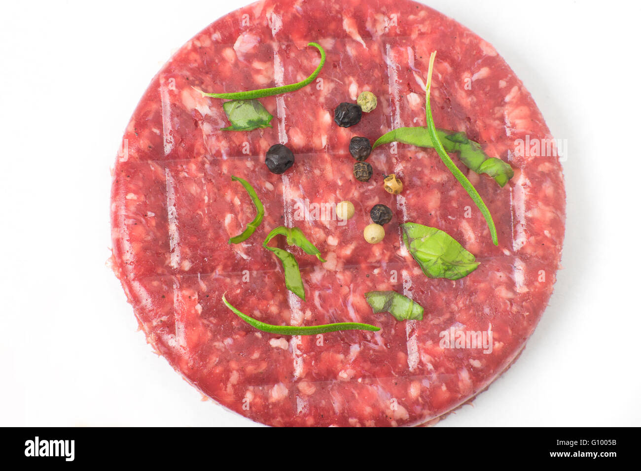 Raw beef hamburger isolated on white background top view Stock Photo
