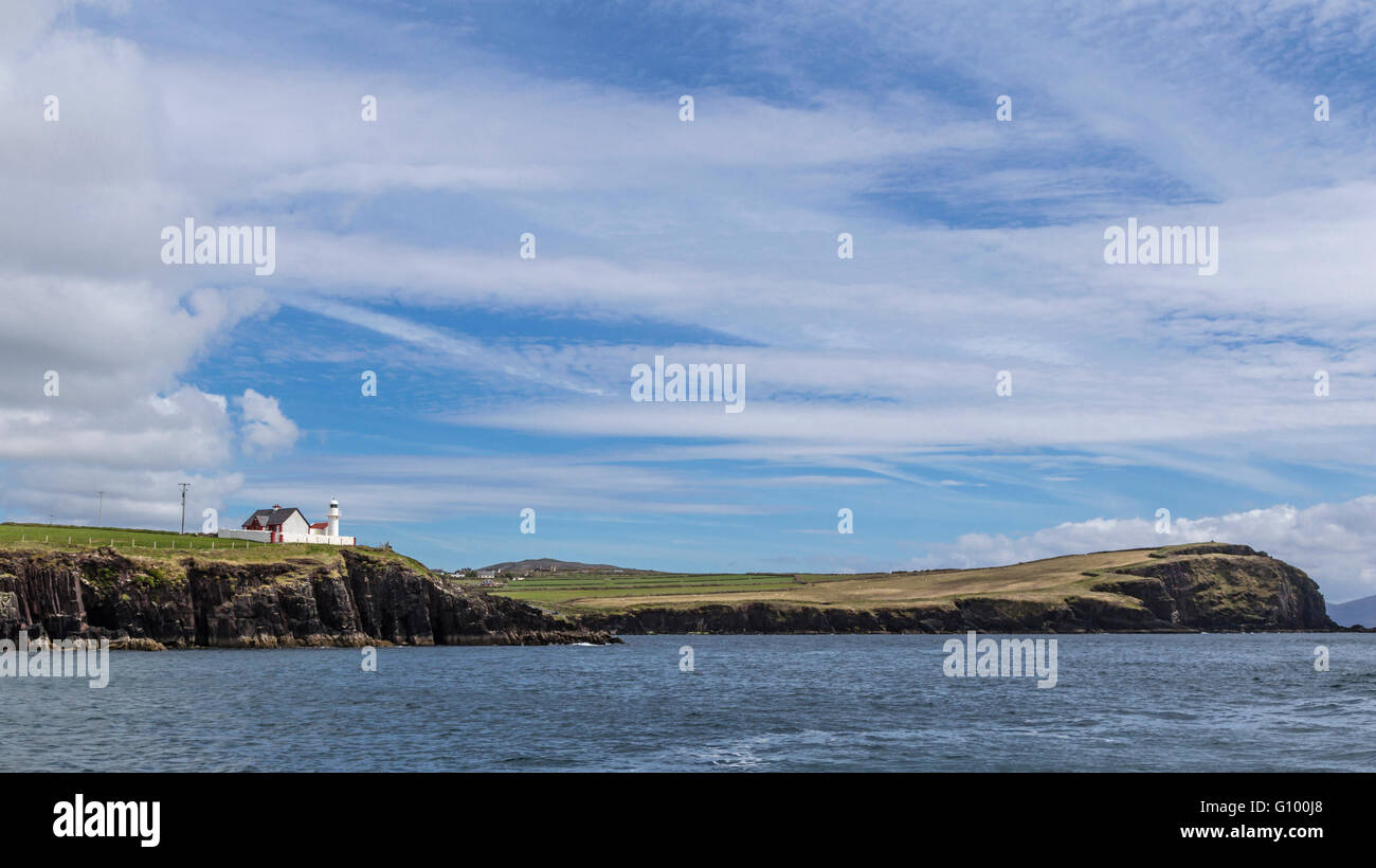 Lighthouse of Dingle, situated high on the cliffs, viewed from Dingle Bay, Dingle Peninsula, County Kerry, Republic of Ireland. Stock Photo