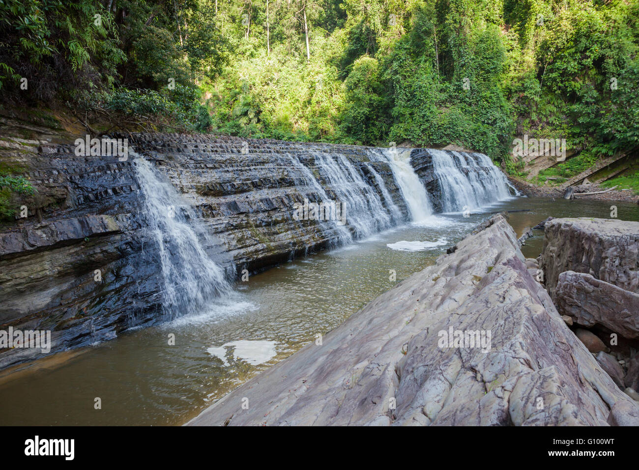 View of Imbak Falls in Imbak Canyon Conservation area, in remote rainforest of Sabah, Borneo Malaysia. Stock Photo