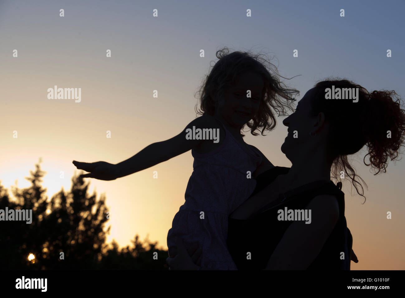 Backlighting. Mother with a child. Sunset. Pudent Lake. Formentera. Balearic Islands, Spain, Europe. Stock Photo