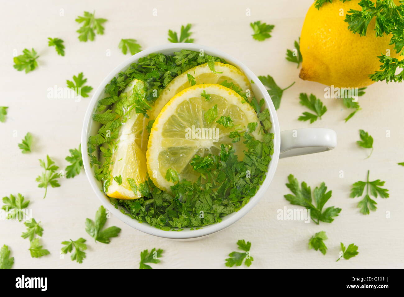 Water with parsley and lemon. Diet beverage Stock Photo Alamy