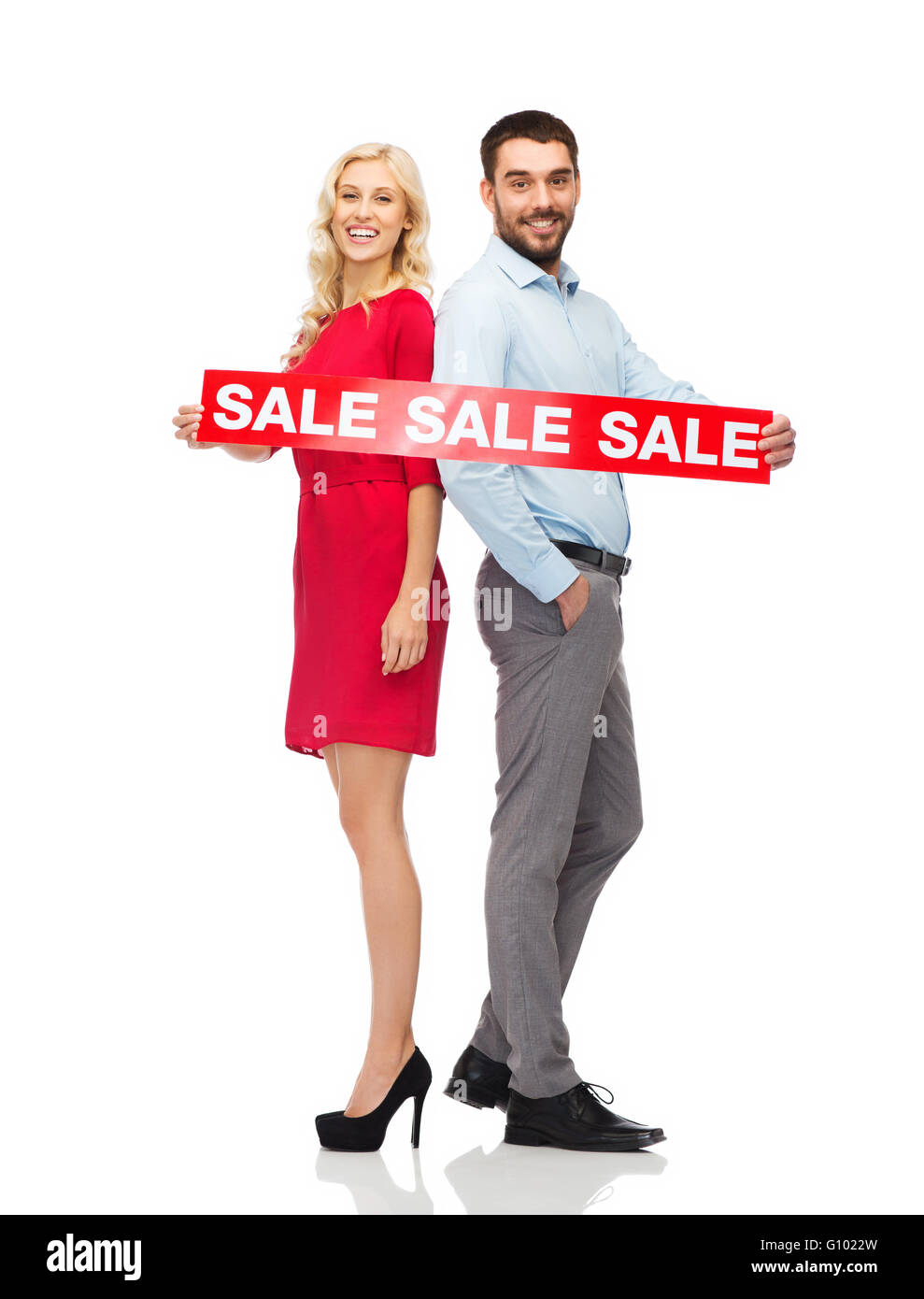 couple with red sale sign standing to back Stock Photo - Alamy