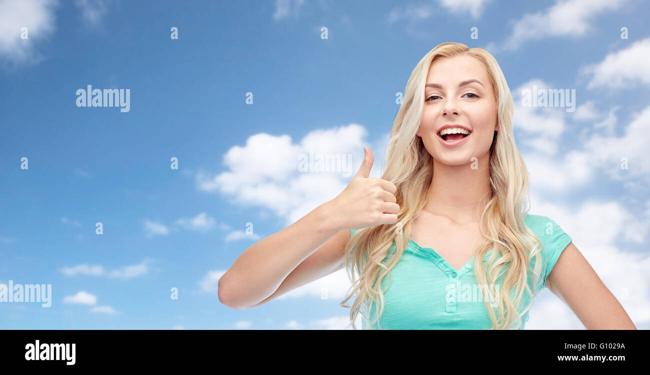 happy woman or teenage girl showing thumbs up Stock Photo - Alamy