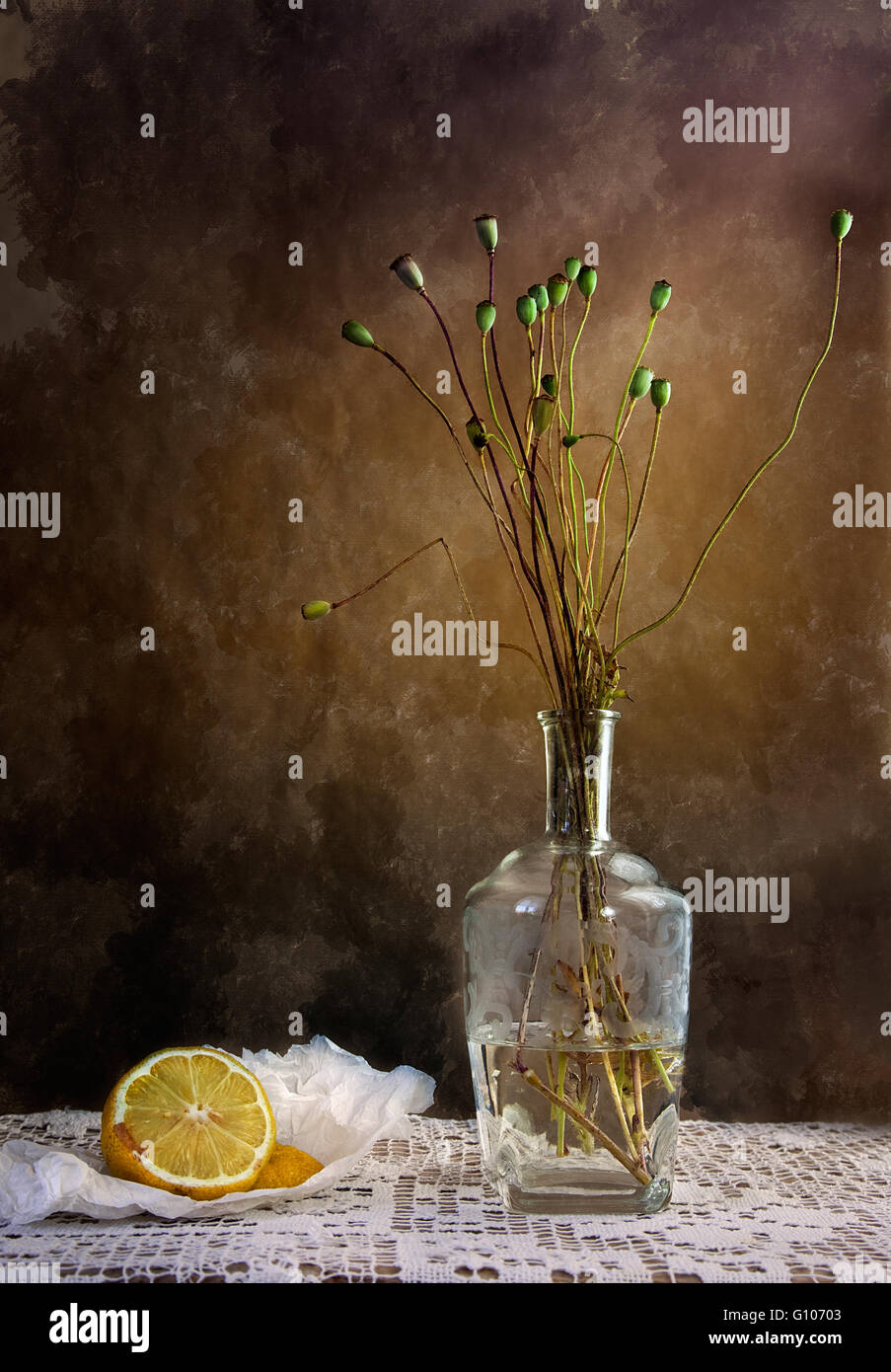 Still Life with Lemon and withered poppies in vase Stock Photo