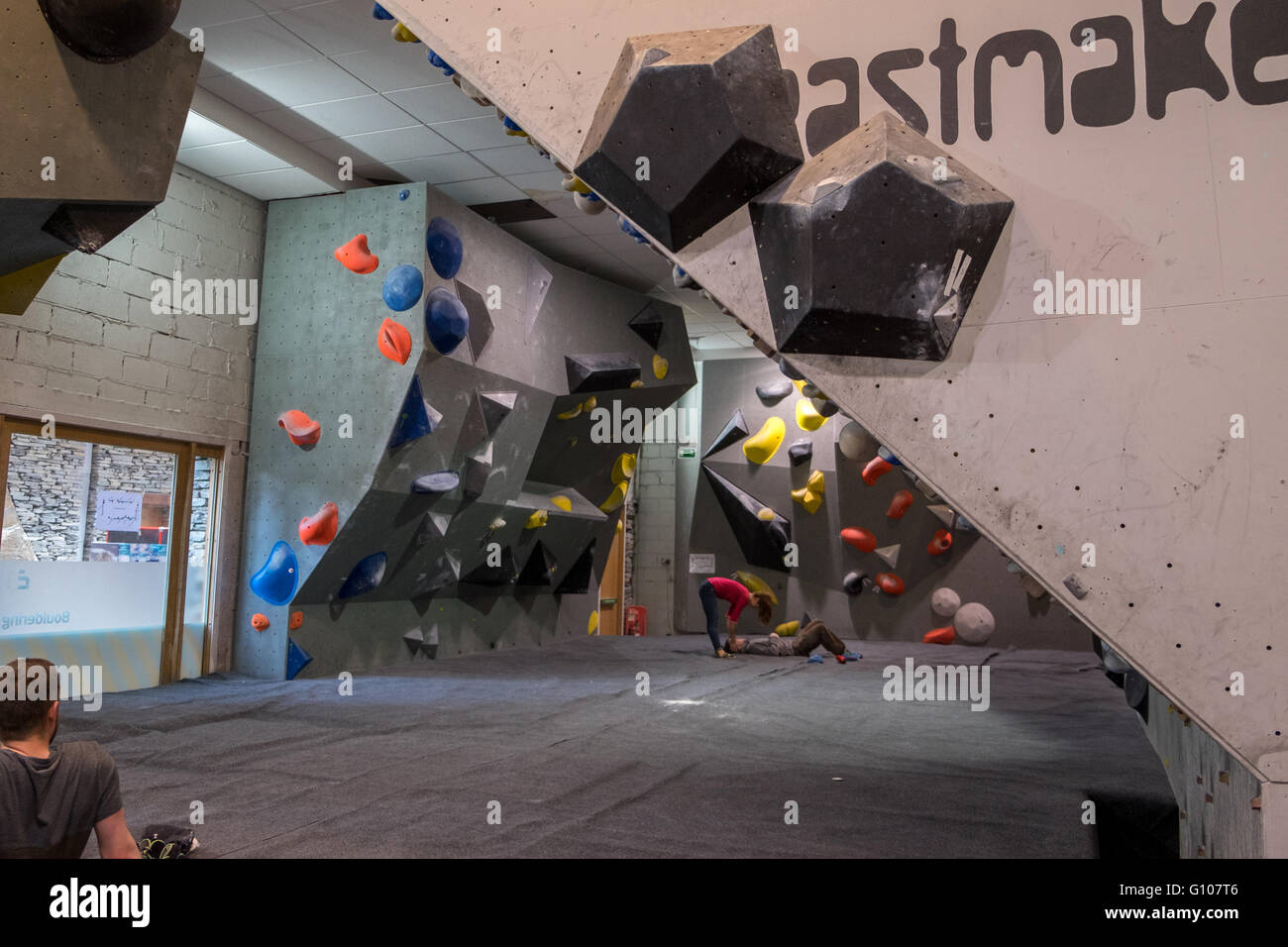 Climber bouldering at an indoor rock climbing centre in Ratho Edinburgh