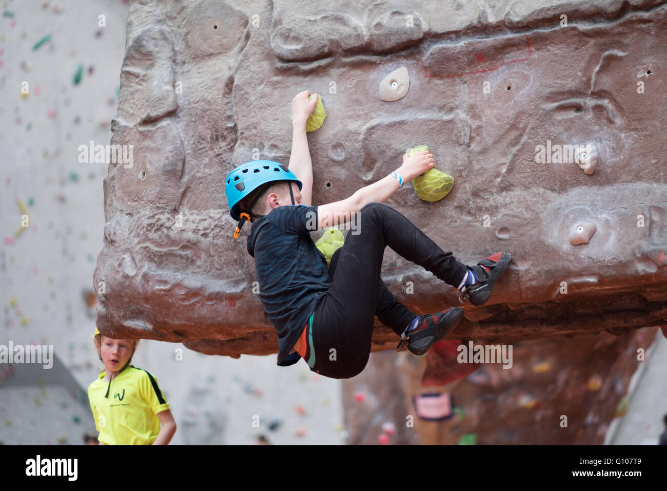 Climber bouldering at an indoor rock climbing centre in Ratho Edinburgh Stock Photo
