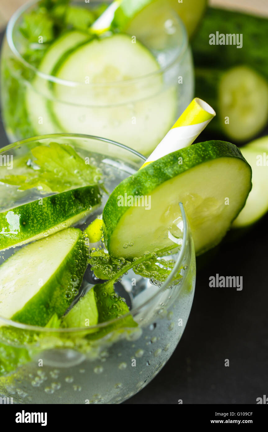 Cold fresh lemonade with cucumber and ice, selective focus Stock Photo