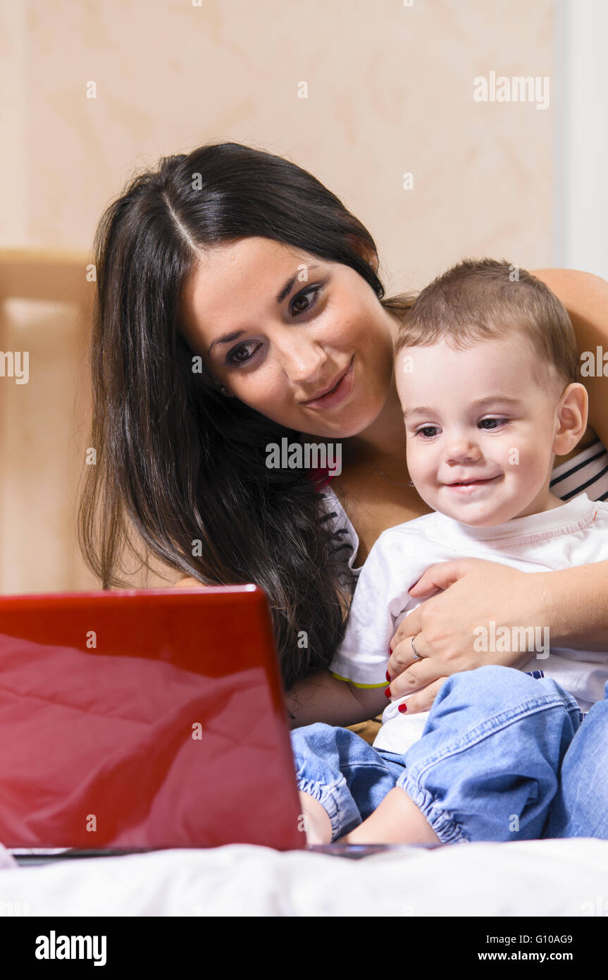 mother and son are using laptop Stock Photo - Alamy