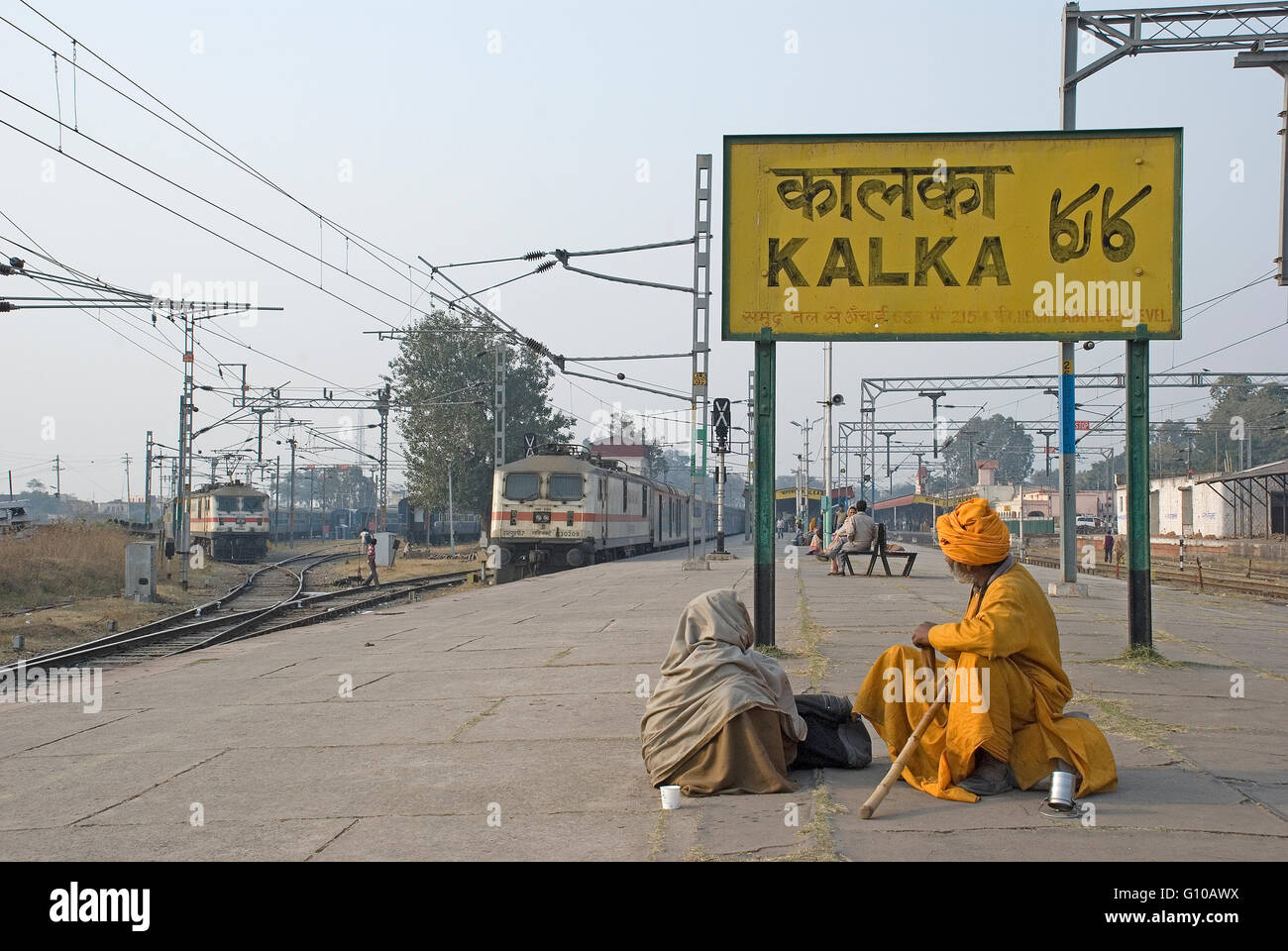 Hindu pilgrims wait for their train at Kalka Railway station, Haryana, India Stock Photo