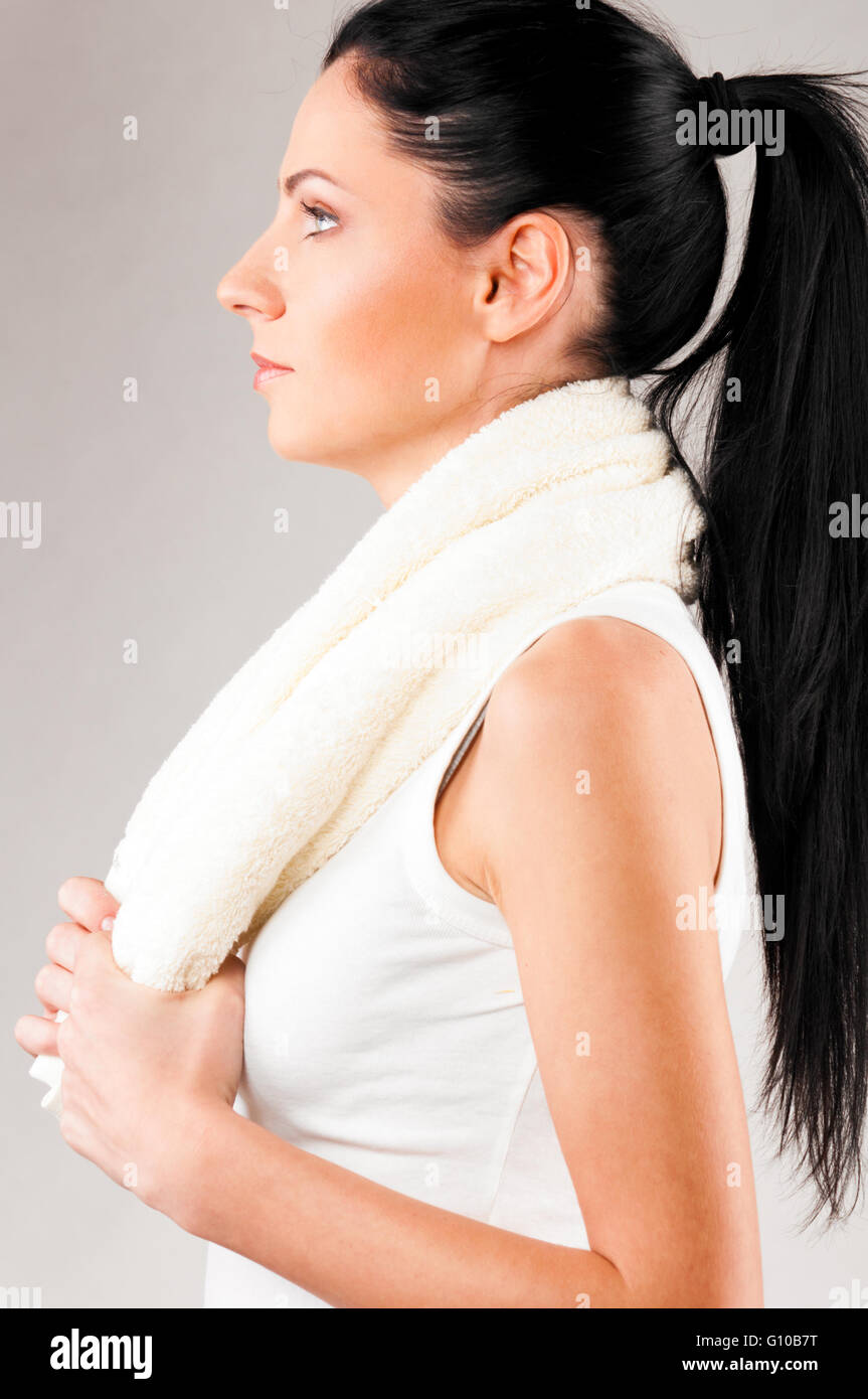 sporty woman with towel Stock Photo - Alamy
