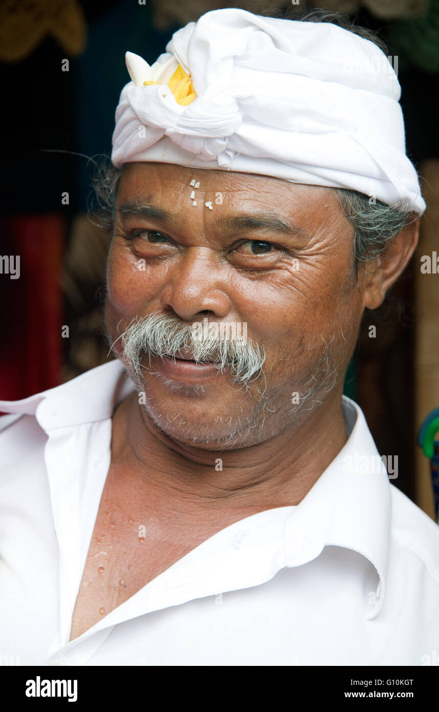 Portrait man wearing traditional hat Ubud Bali Indonesia Stock Photo