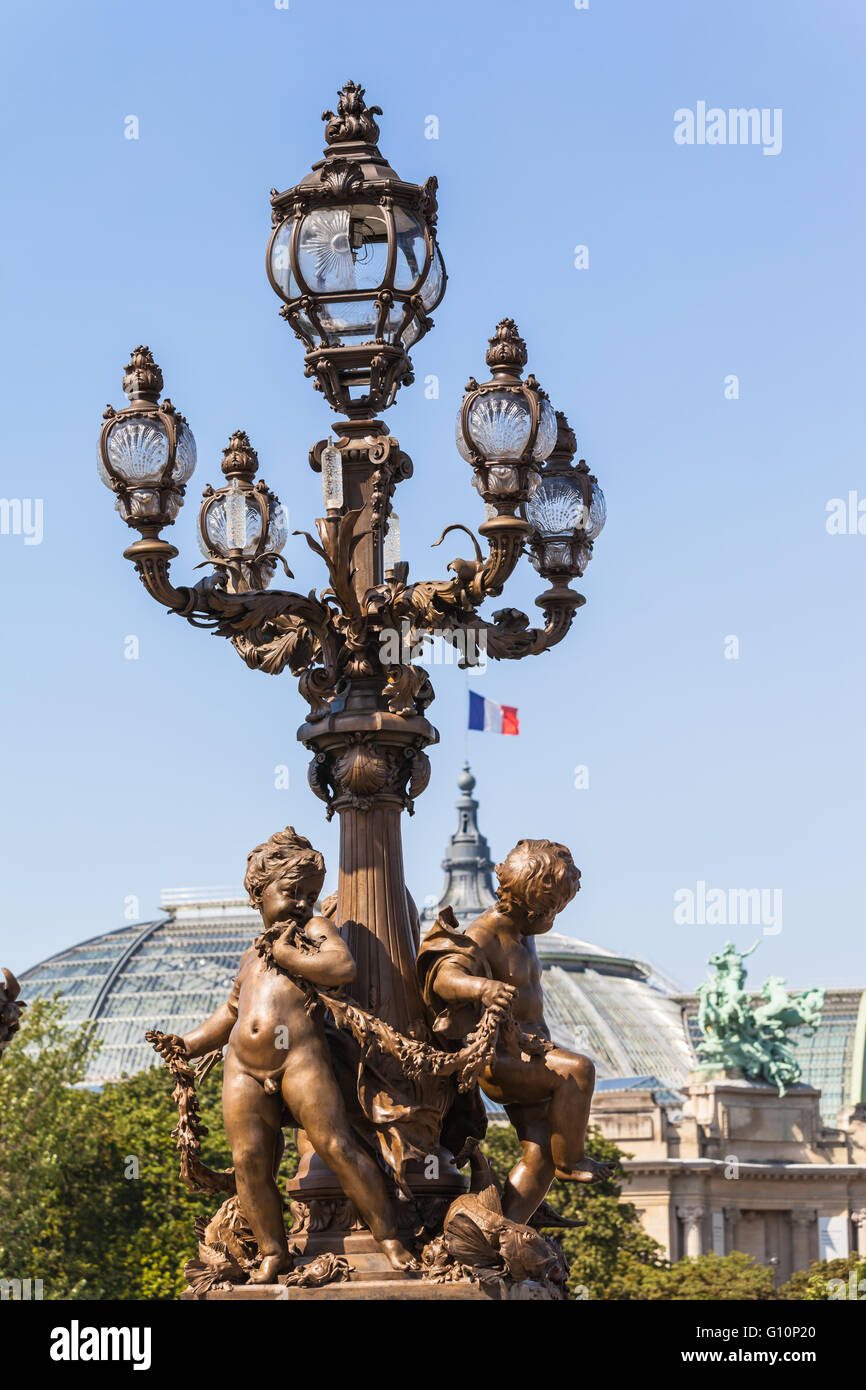 Lamp post with sculpture at bottom on the bridge of Pont Alexandre III Stock Photo