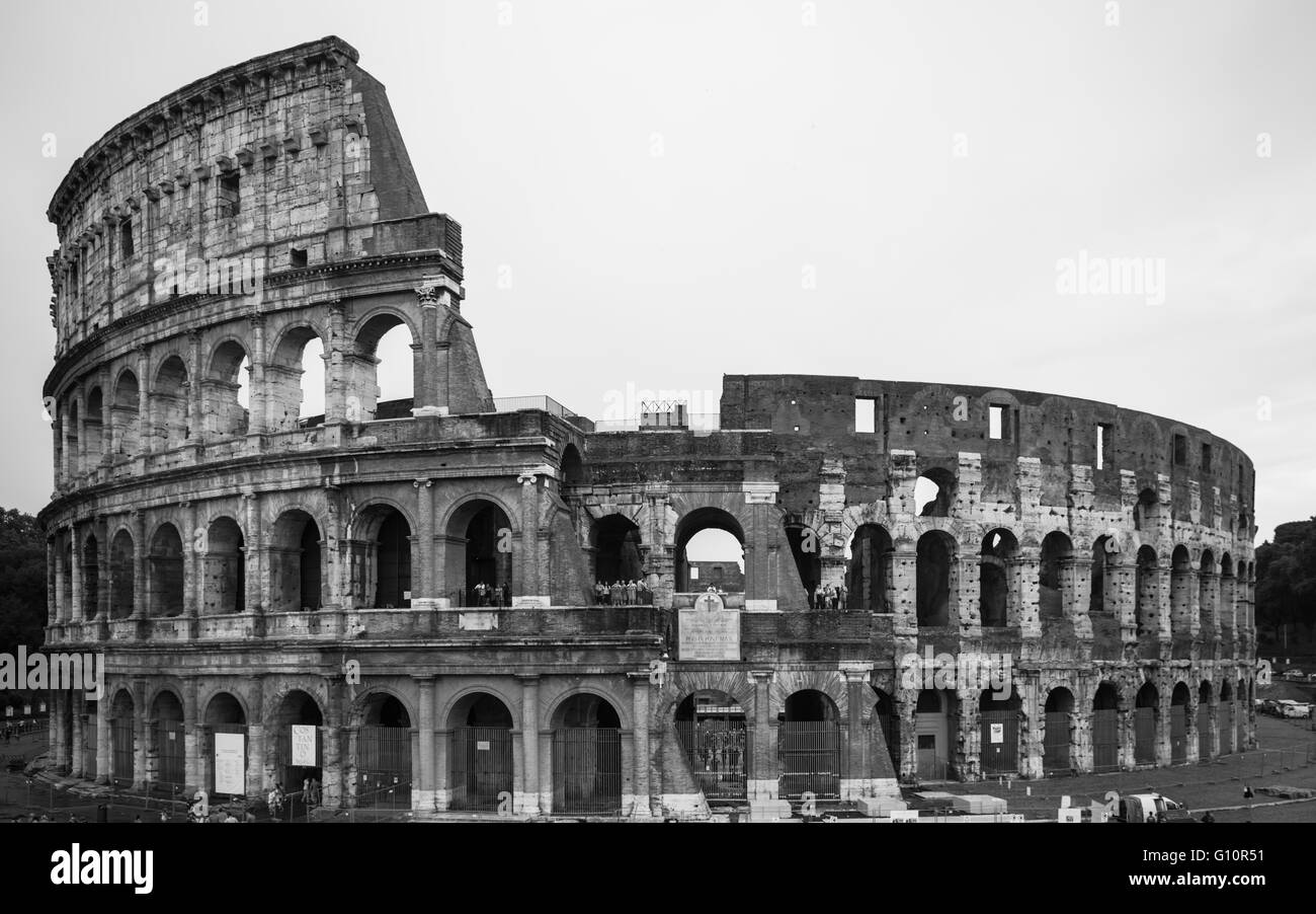 Exterior scene of the ancient colosseum ruin in black and white, Rome, Italy Stock Photo