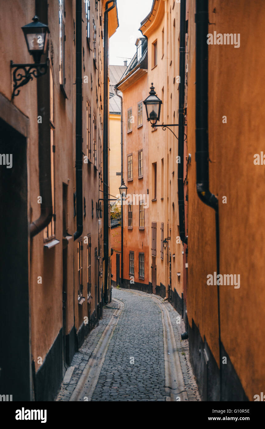 Colorful narrow street in Old Town (Gamla Stan) of Stockholm, Sweden Stock Photo