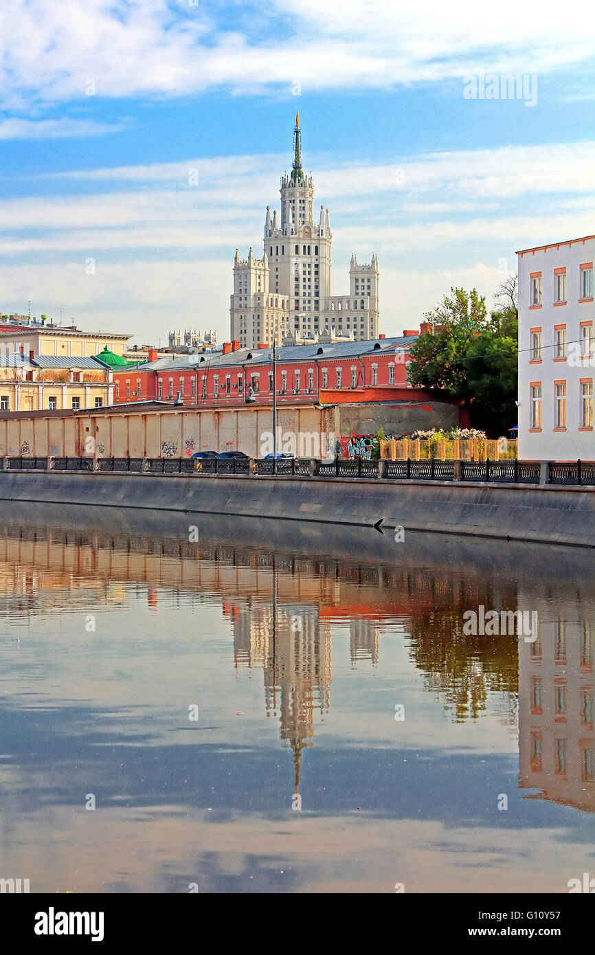 Stalin's Empire style building and reflection in the water in Moscow, Russia Stock Photo