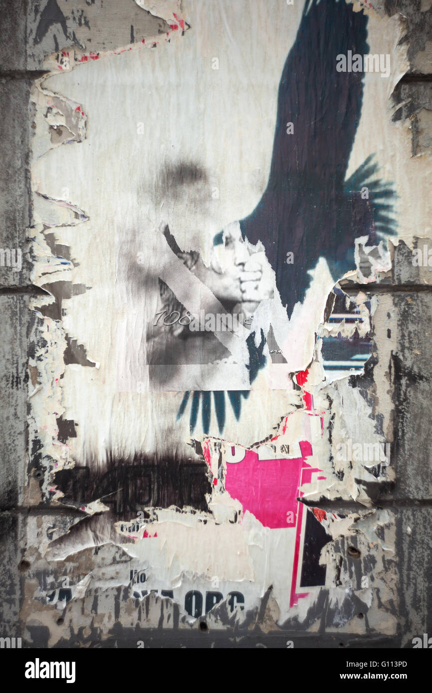 Photo of italian torn poster in Trieste wall Stock Photo