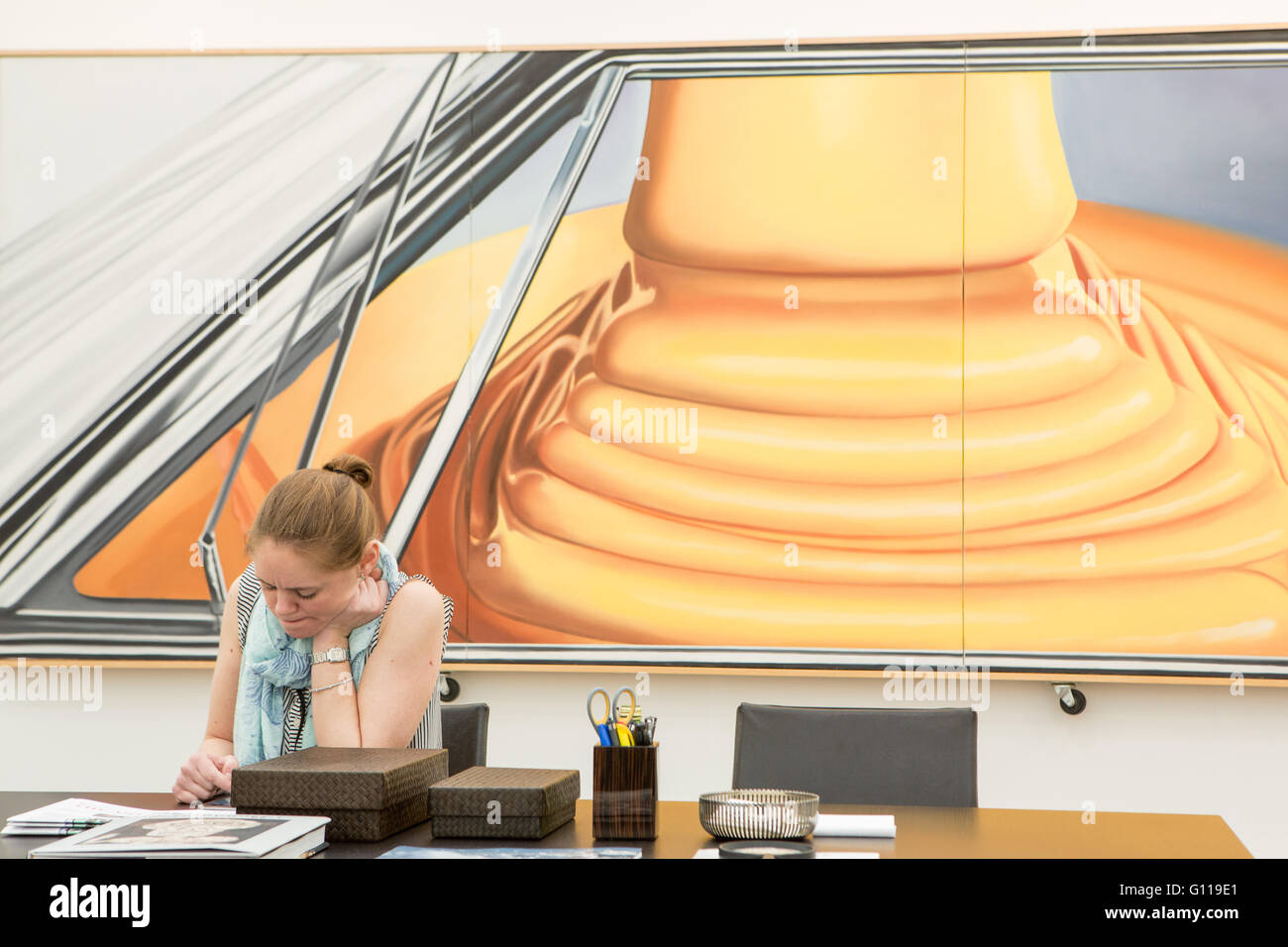 New York, New York, USA. 06th May, 2016. Frieze New York art fair. Part of James Rosenquist's oil 'Highway Trust' behind a gallery attendant at Aquavella. Credit:  Ed Lefkowicz/Alamy Live News Stock Photo