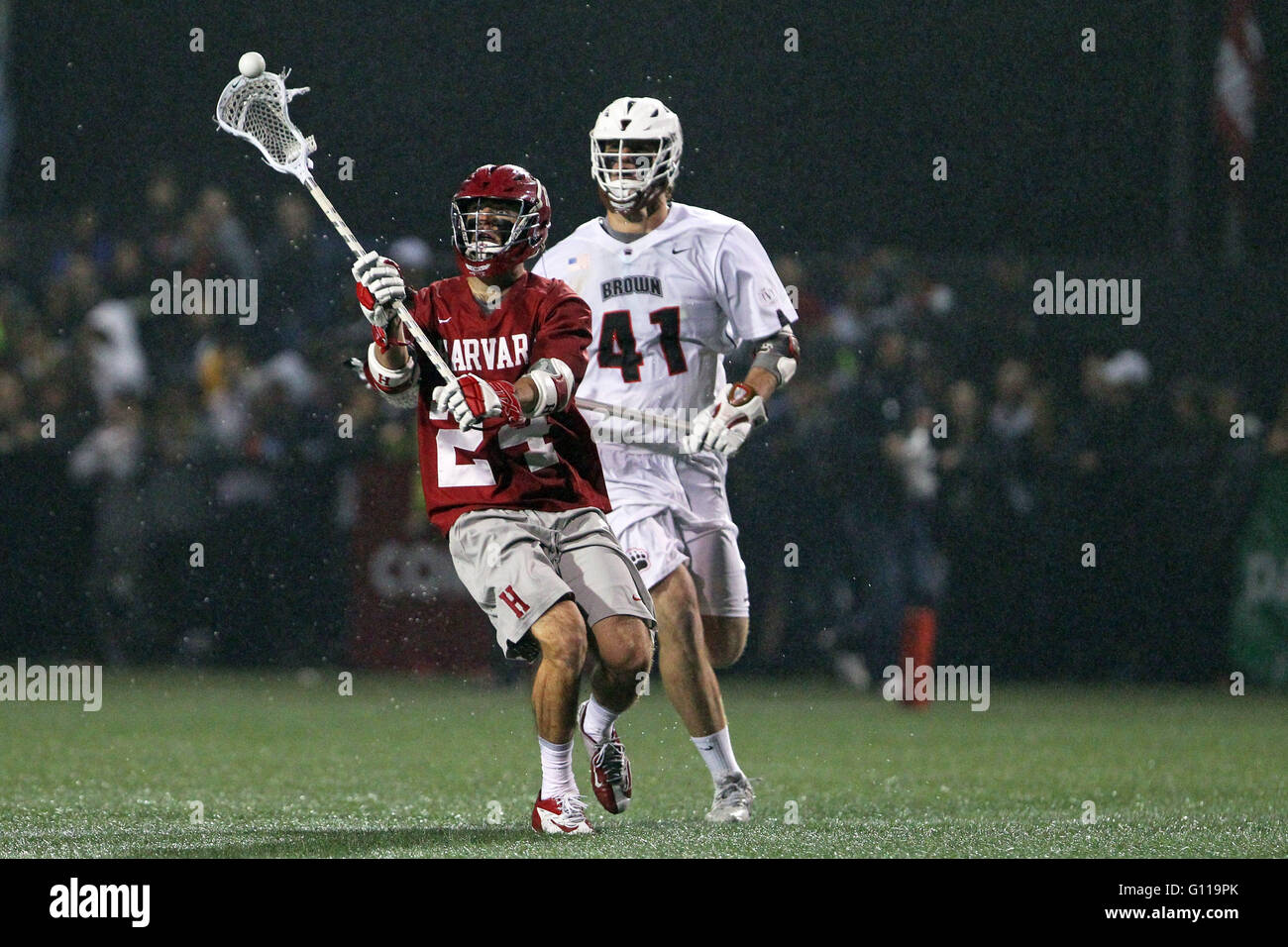 Stevenson-Pincince Field. 6th May, 2016. RI, USA; Harvard Crimson midfielder Ian Ardrey (21) is pursued by Brown Bears midfielder Brendan Caputo (41) during the second half of the NCAA Ivy League Tournament Lacrosse game between Harvard Crimson and Brown Bears at Stevenson-Pincince Field. Harvard defeated Brown 13-12. Anthony Nesmith/Cal Sport Media/Alamy Live News Stock Photo