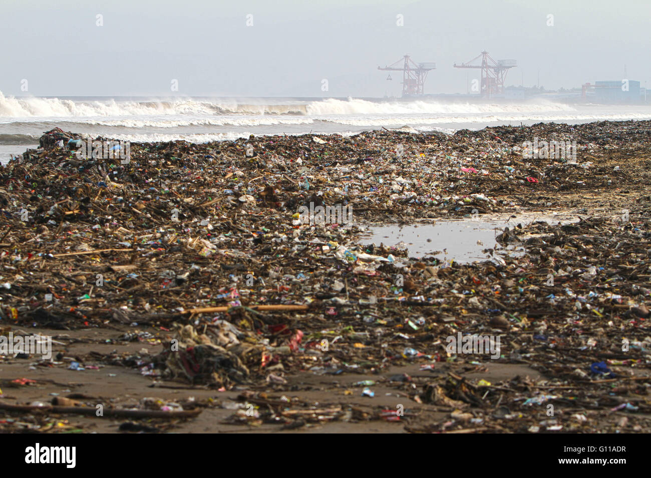 Sukabumi, West Java, Indonesia. 5th May, 2016. Garbage on Loji beach, Sukabumi, West Java. Marine debris is mainly discarded human rubbish which floats on, or is suspended in the ocean. Eighty percent of marine debris is plastic - a component that has been rapidly accumulating since the end of World War II. The mass of plastic in the oceans may be as high as one hundred million metric tons. © Afriadi Hikmal/ZUMA Wire/Alamy Live News Stock Photo