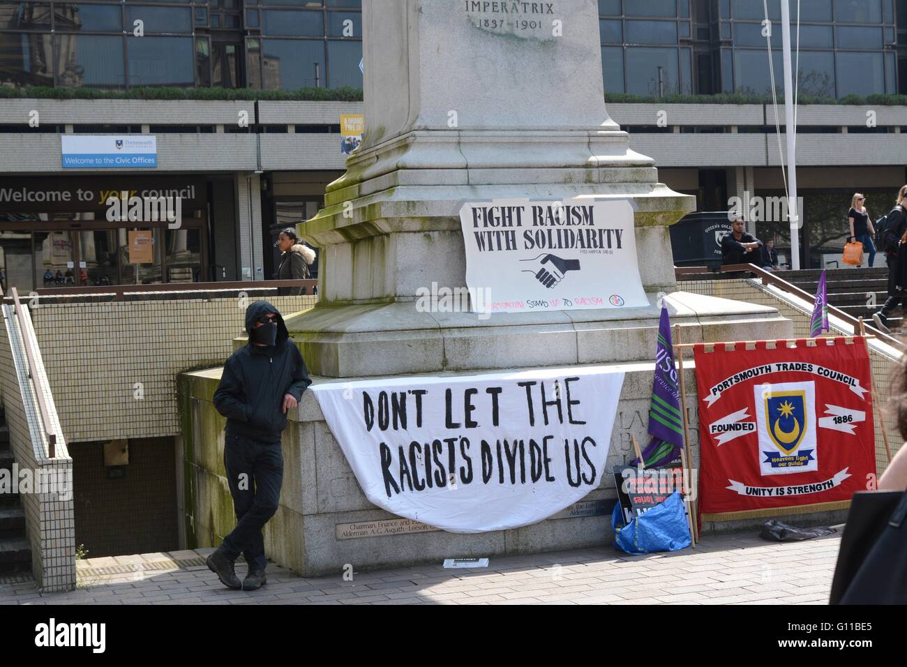 Portsmouth, UK. 7th May 2016. Anti-fascist protester stands in the shade on a gloriously sunny day. Credit: Marc Ward/Alamy Live News Stock Photo