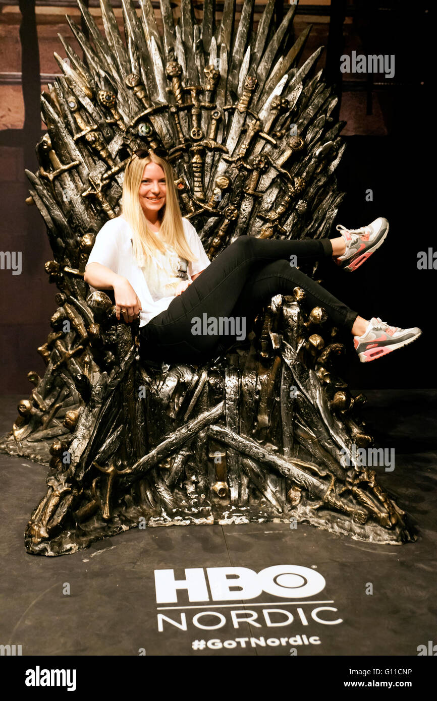 Copenhagen, Denmark, May 7th, 2016. HBO Nordic and their popular series invites Copenhageners to take part in the play at Oeksnehallen. At the photo a young woman has her selfie taken with her sitting on the  Iron Throne. This is part of an HBO promotional tour. Credit:  OJPHOTOS/Alamy Live News Stock Photo