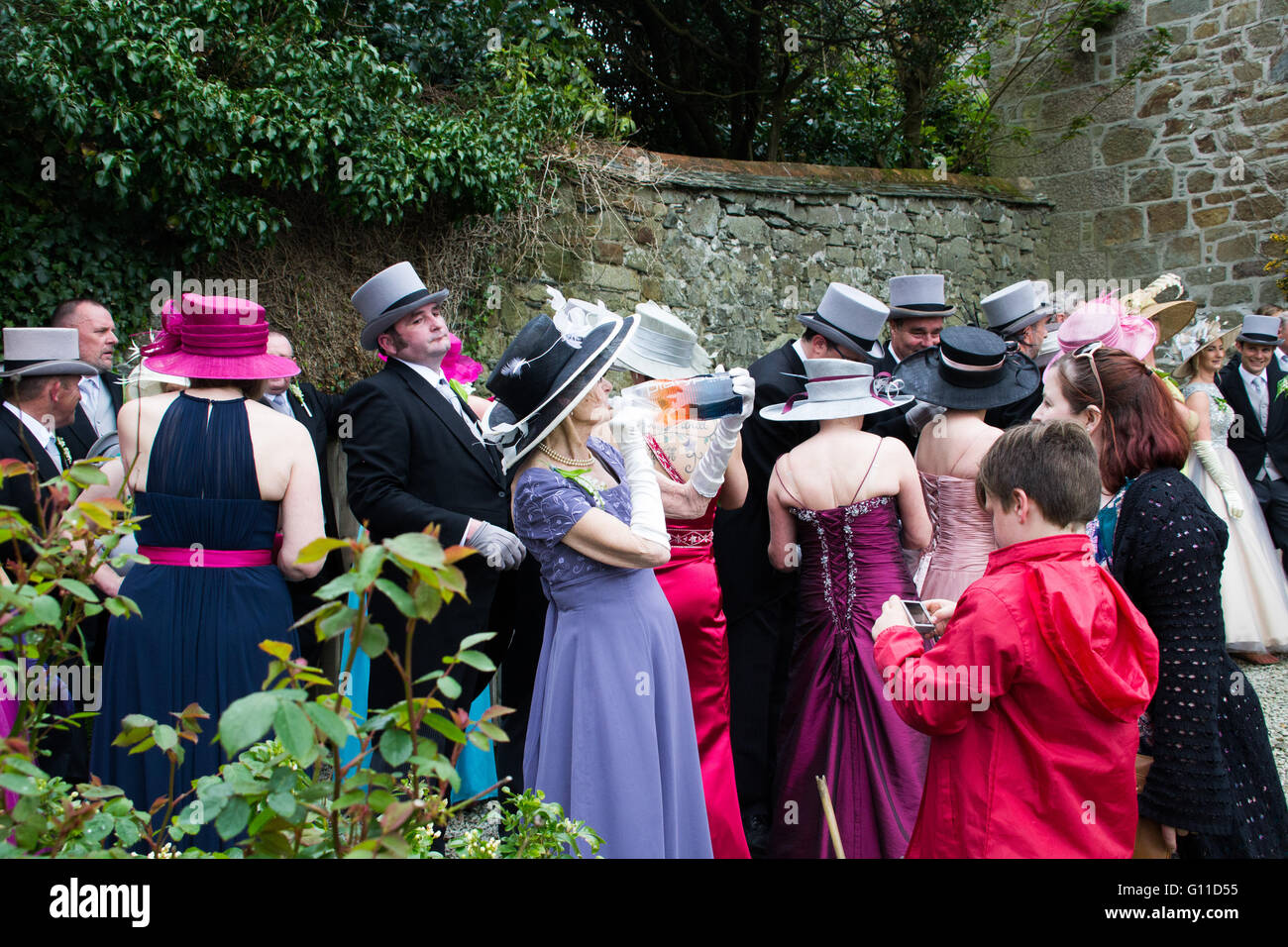 Helson, Cornwall, UK. 7th May 2016. Some eighty couples dance through the streets of Helston, entering selected houses and shops to drive out the darkness of winter and bring in the light of spring. The music to the Furry dance is played by Helston Town band, was made into a vocal version 'The floral dance' by the late Sir Terry Wogan. The colourful Pageant, known as Hal an Tow, tells the history of Helston with the participating characters singing about the challenge of the Spanish Armada, the English patron saint, St. Credit:  Simon Maycock/Alamy Live News Stock Photo