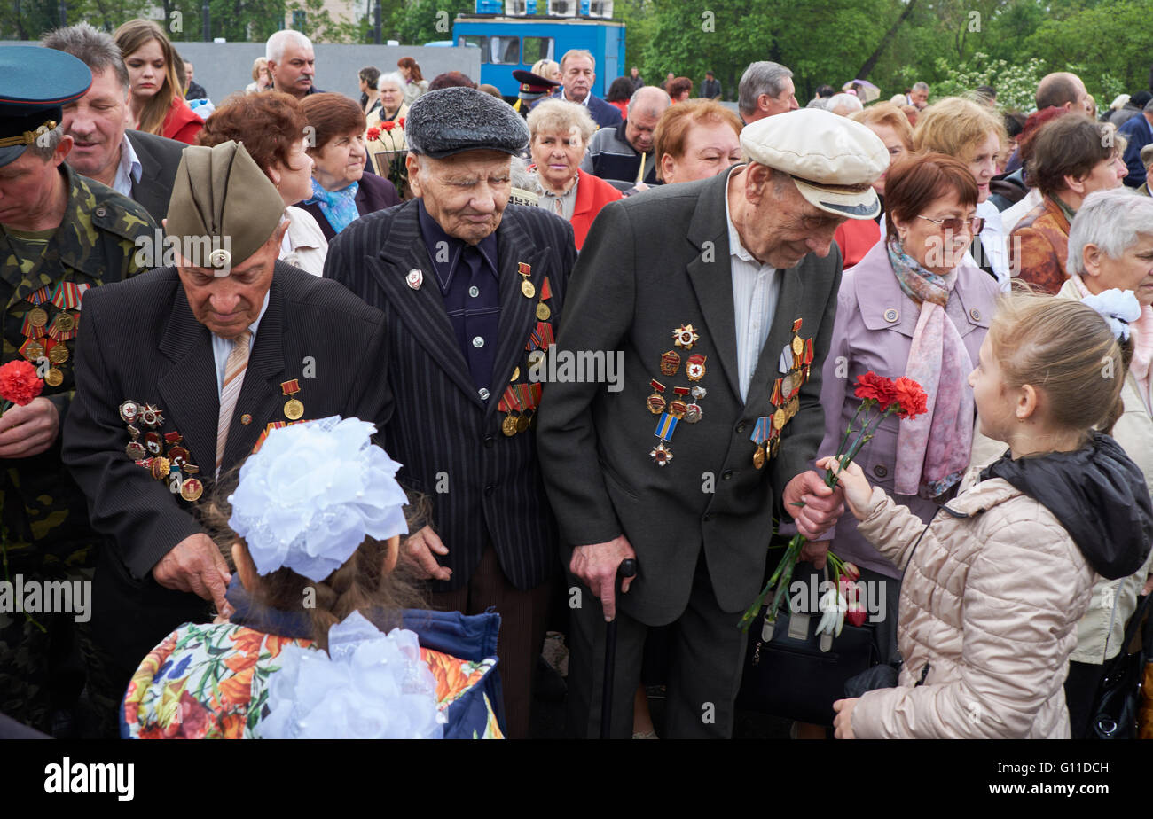 Kryvyi Rih, Ukraine - May 7, 2016: Children give flowers to veterans ...