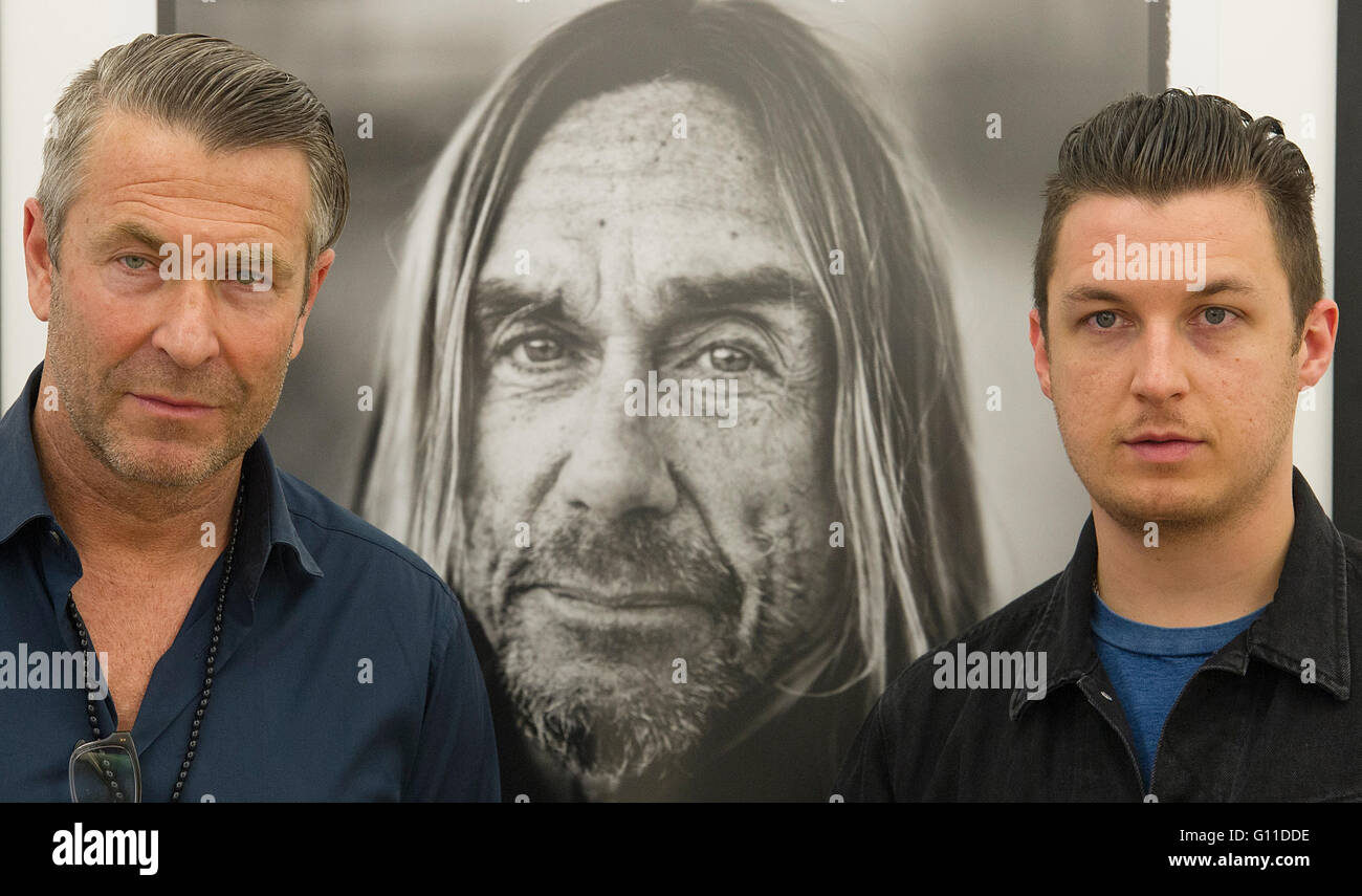 Berlin, Germany. 06th May, 2016. Photographers Andreas Neumann (L) and Matt  Helders pose in front of a photo of Iggy Pop during the opening of the  exhibition 'American Valhalla: The Art of