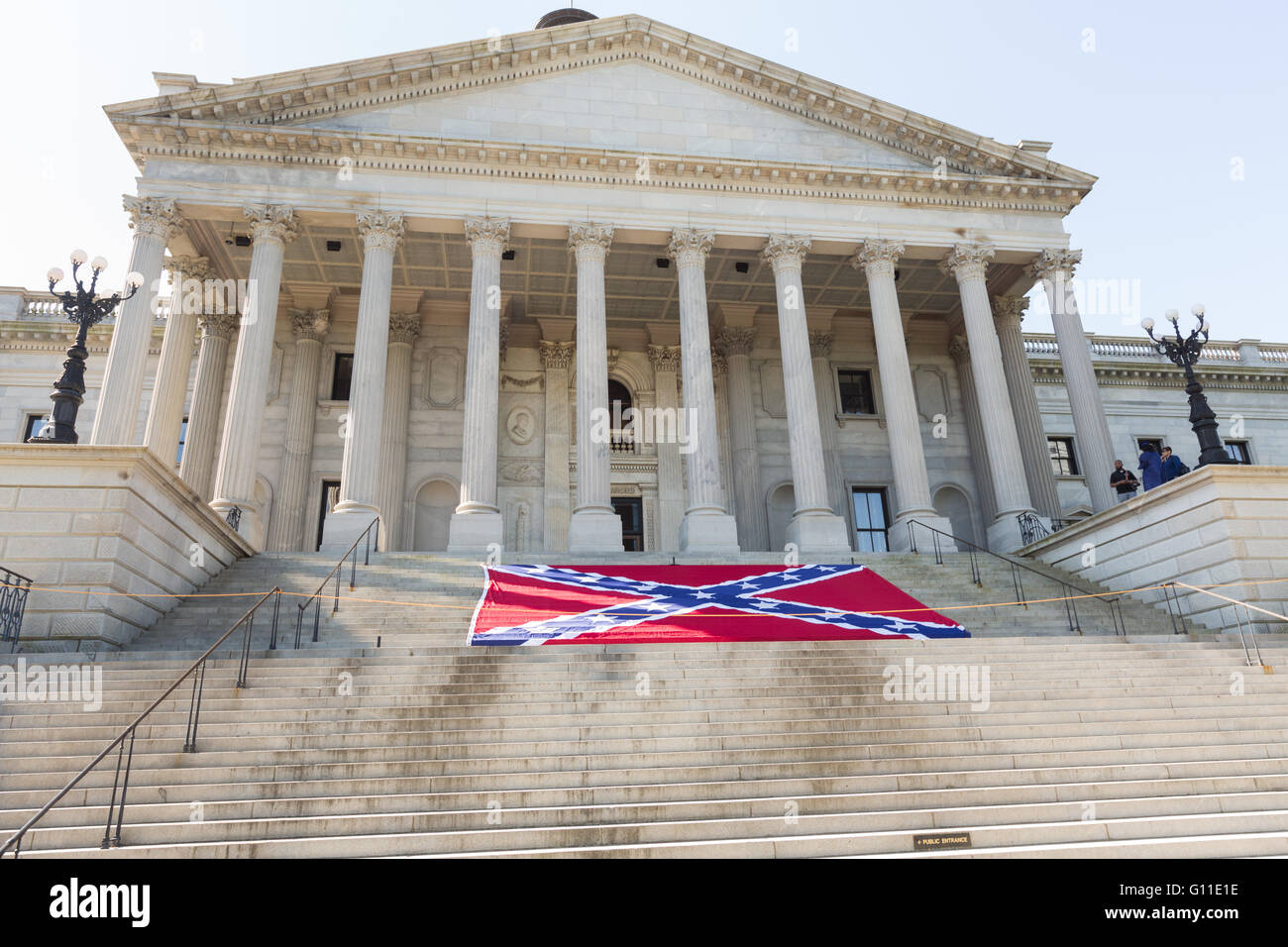 Columbia, South Carolina, USA. 07th May, 2016. A giant Confederate Battle flag on the steps of the State House to mark Confederate Memorial Day May 7, 2016 in Columbia, South Carolina. The events marking southern Confederate heritage come nearly a year after the removal of the confederate flag from the capitol following the murder of nine people at the historic black Mother Emanuel AME Church. Credit:  Planetpix/Alamy Live News Stock Photo