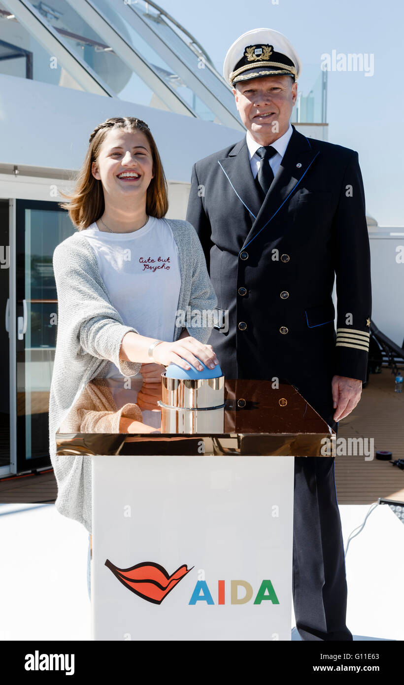 Emma Schweiger, daughter of Till Schweiger, und Detlev Harms, captain of the AIDAprima, pose on board the ship Hamburg, Germany, 07 May 2016. The young actress will christen the ship during the 827th Port Anniversary this evening. Photo: MARKUS SCHOLZ/dpa Stock Photo