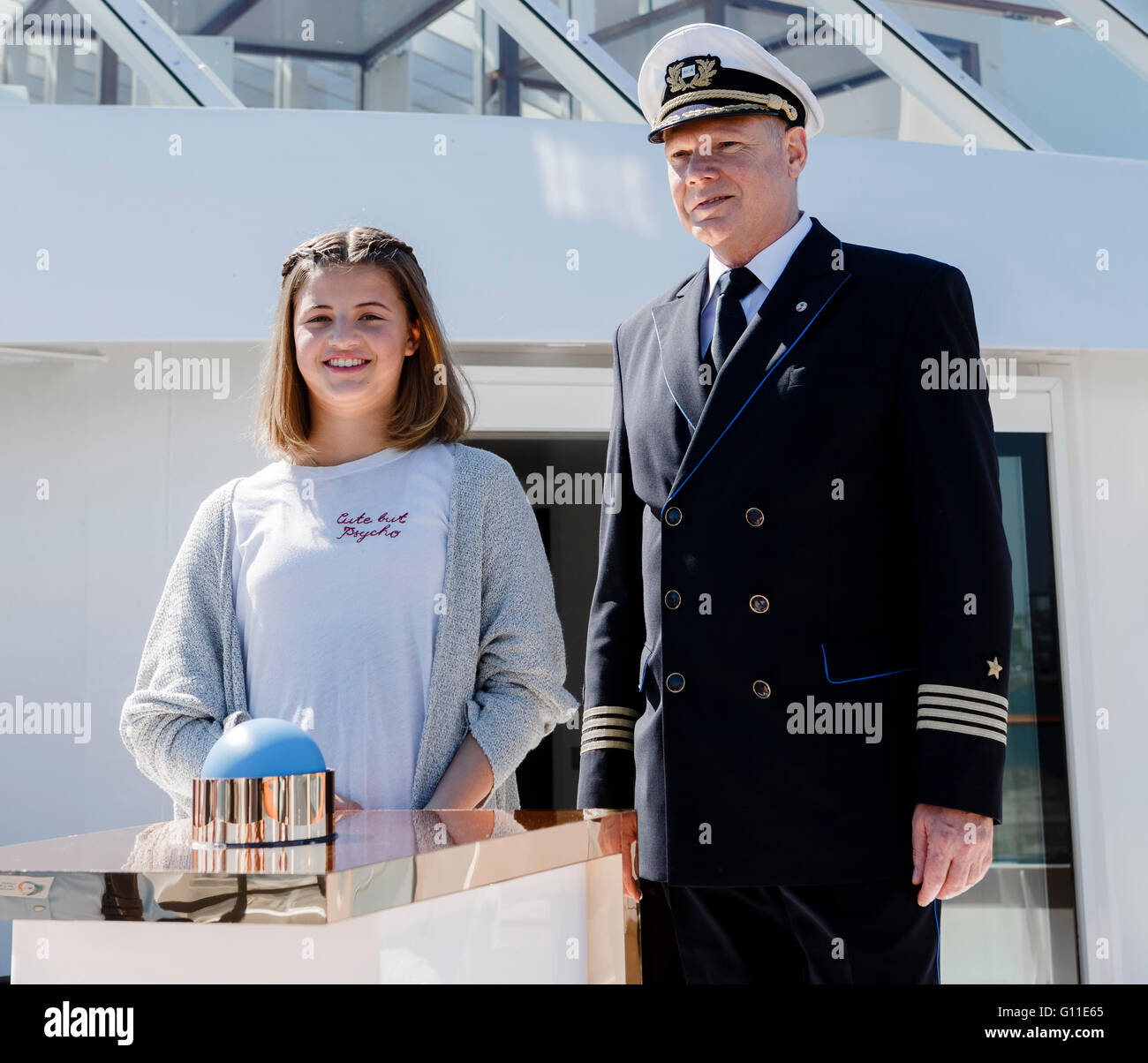 Emma Schweiger, daughter of Till Schweiger, und Detlev Harms, captain of the AIDAprima, pose on board the ship Hamburg, Germany, 07 May 2016. The young actress will christen the ship during the 827th Port Anniversary this evening. Photo: MARKUS SCHOLZ/dpa Stock Photo