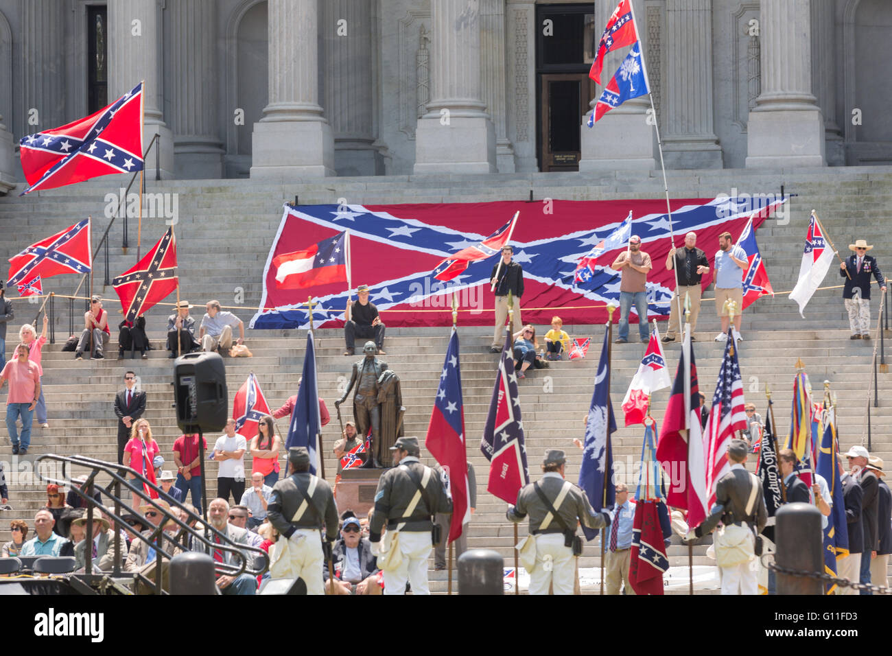 Columbia, South Carolina, USA. 07th May, 2016. Costumed confederate re-enactors rally on the steps of the State House to celebrate Confederate Memorial Day May 7, 2016 in Columbia, South Carolina. The events marking southern Confederate heritage come nearly a year after the removal of the confederate flag from the capitol following the murder of nine people at the historic black Mother Emanuel AME Church. Credit:  Planetpix/Alamy Live News Stock Photo