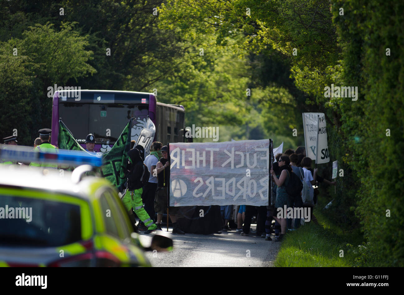 London Gatwick, UK. 7th May 2016. International Day of Action Against Detention. Demonstrations outside Brook House & Tinsley House Immigration Removal Centres at Gatwick Airport. Protesters are calling to “shut down detention centres – migrants welcome, open borders”, with the campaign #ShutThemDown. The centres, run by private security firm G4S, are said to be detaining asylum seekers and foreigners without charge whilst under ‘administrative detention’. Stock Photo