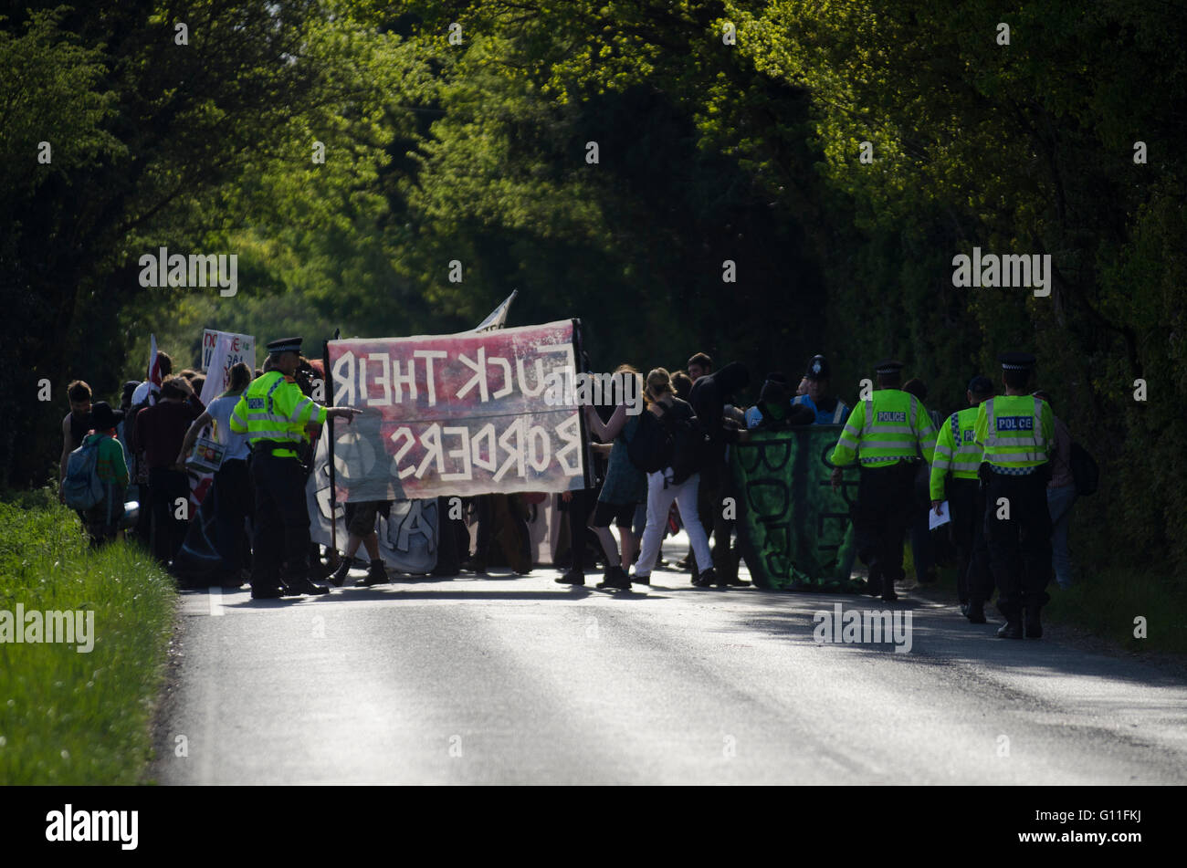 London Gatwick, UK. 7th May 2016. International Day of Action Against Detention. Demonstrations outside Brook House & Tinsley House Immigration Removal Centres at Gatwick Airport. Protesters are calling to “shut down detention centres – migrants welcome, open borders”, with the campaign #ShutThemDown. The centres, run by private security firm G4S, are said to be detaining asylum seekers and foreigners without charge whilst under ‘administrative detention’. Stock Photo