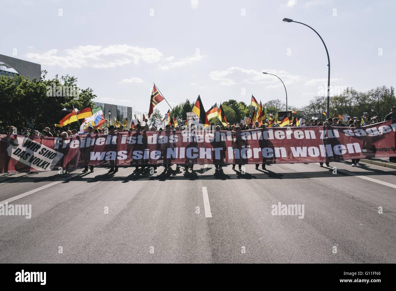 Berlin, Germany. 7th May, 2016. 'Freedom is the right to tell others what they do not want to hear' Protesters holding a large banner during the rally held under the motto 'Merkel muss weg![Merkel must go]' organised by far-right group 'We for Berlin & We for Germany' Credit:  Jan Scheunert/ZUMA Wire/Alamy Live News Stock Photo