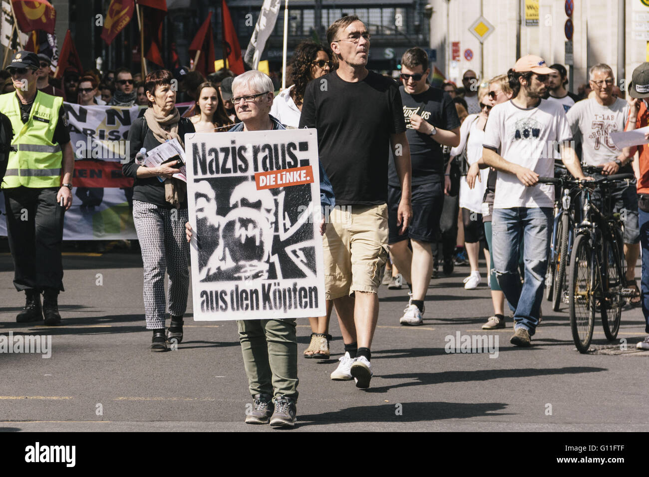 Berlin, Berlin, Germany. 7th May, 2016. 'Nazis out of the minds' A protester holding a sign during counter protests against the rally held under the motto 'Merkel muss weg![Merkel must go]' organised by far-right group 'We for Berlin & We for Germany' Credit:  Jan Scheunert/ZUMA Wire/Alamy Live News Stock Photo