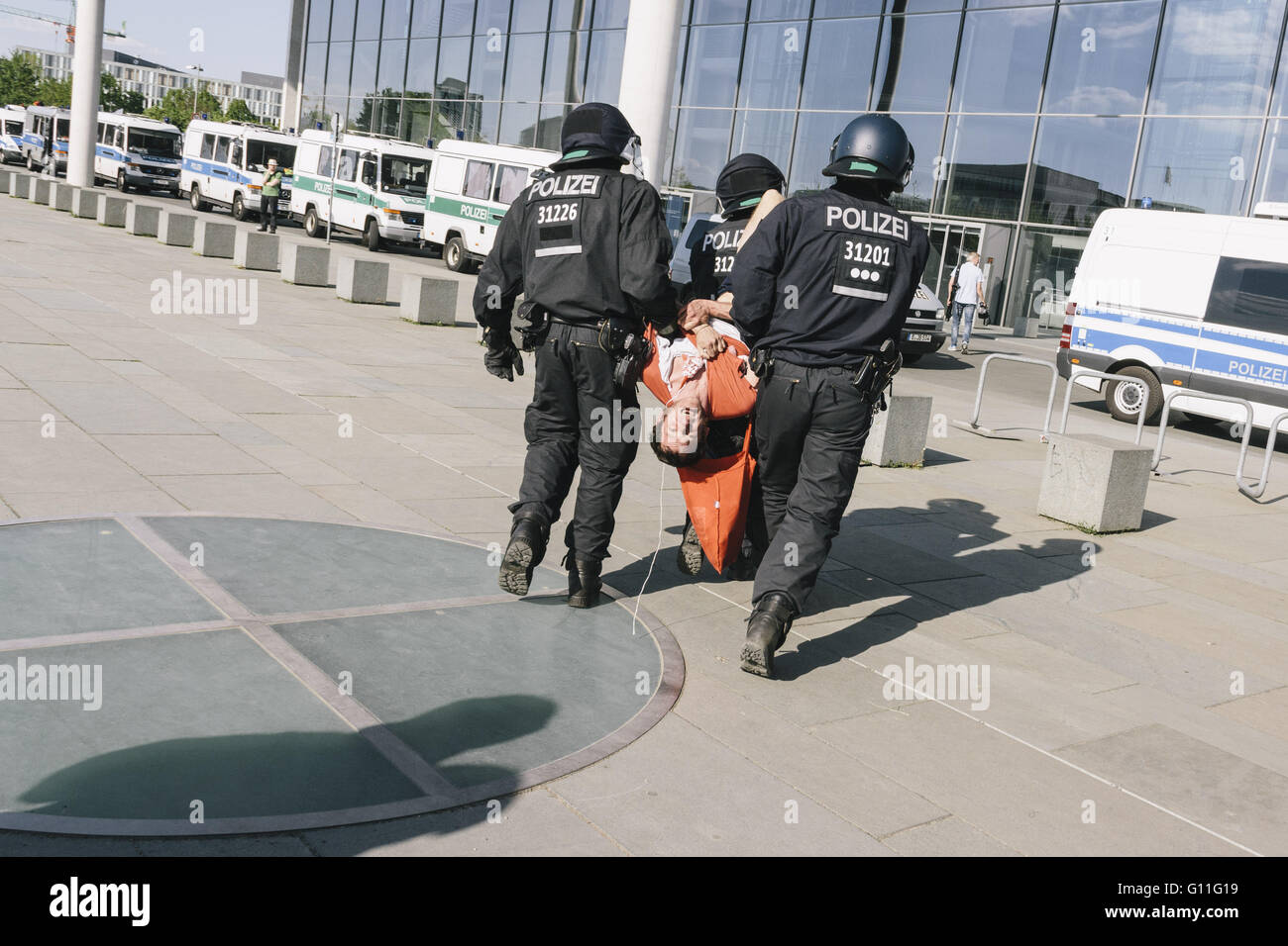 Berlin, Berlin, Germany. 7th May, 2016. An activist is arrested by the police during the counter protests against the rally held under the motto 'Merkel muss weg![Merkel must go]' organised by far-right group 'We for Berlin & We for Germany' Credit:  Jan Scheunert/ZUMA Wire/Alamy Live News Stock Photo