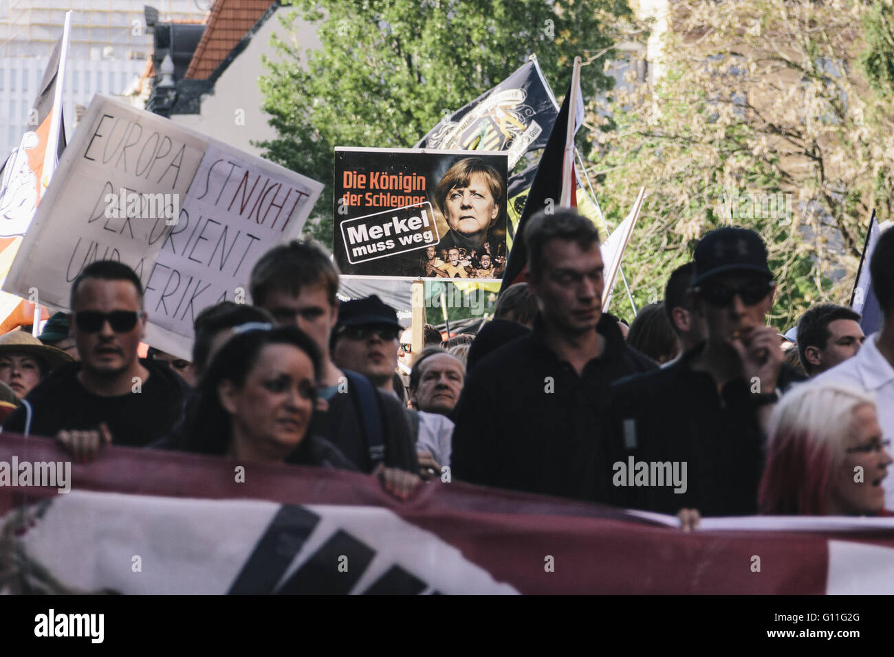 Berlin, Berlin, Germany. 7th May, 2016. 'The queen of people-traffickers. Merkel must go!' A banner during the rally held under the motto 'Merkel muss weg![Merkel must go]' organised by far-right group 'We for Berlin & We for Germany' Credit:  Jan Scheunert/ZUMA Wire/Alamy Live News Stock Photo