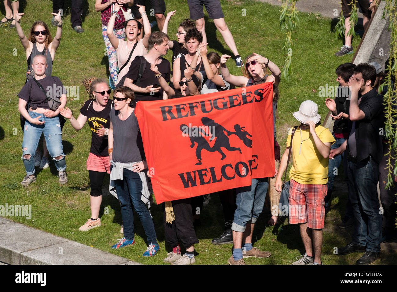 Berlin, Germany. 7th May 2016. Pro-refugee protesters stage counter demonstration against  far -right demonstrators in Berlin Germany. Far-right protesters were demonstrating against islam, refugees and Angela Merkel in Mitte Berlin. Protestors demanded that Chancellor Angela Merkel stand down because of allowing large numbers of refugees and migrants to enter Germany. Credit:  Iain Masterton/Alamy Live News Stock Photo