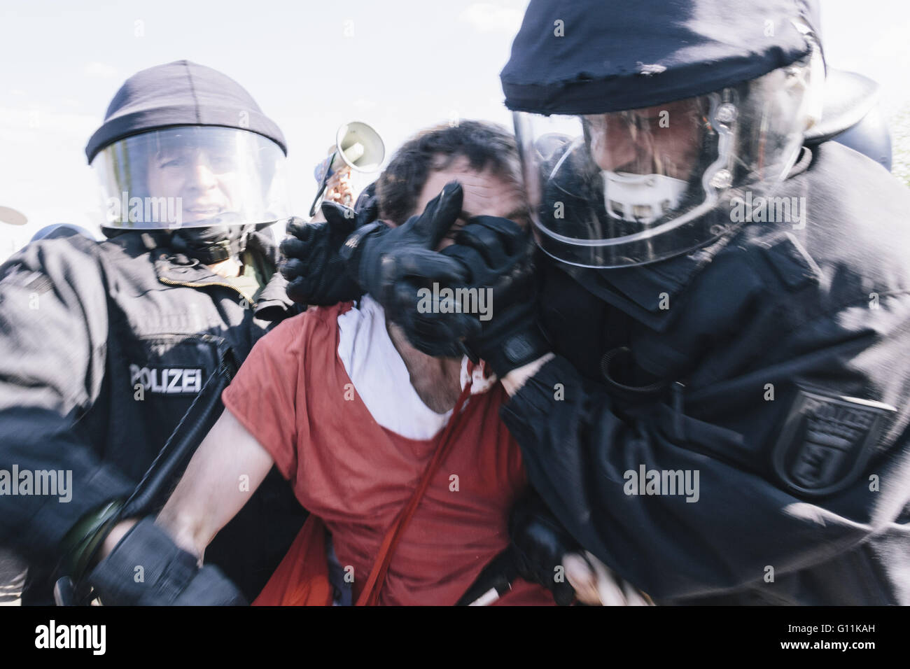 Berlin, Germany. 7th May, 2016. An activist is arrested by the police during the counter protests against rally held under the motto 'Merkel muss weg! 'Merkel must go' organised by far-right group 'We for Berlin & We for Germany' © Jan Scheunert/ZUMA Wire/Alamy Live News Stock Photo