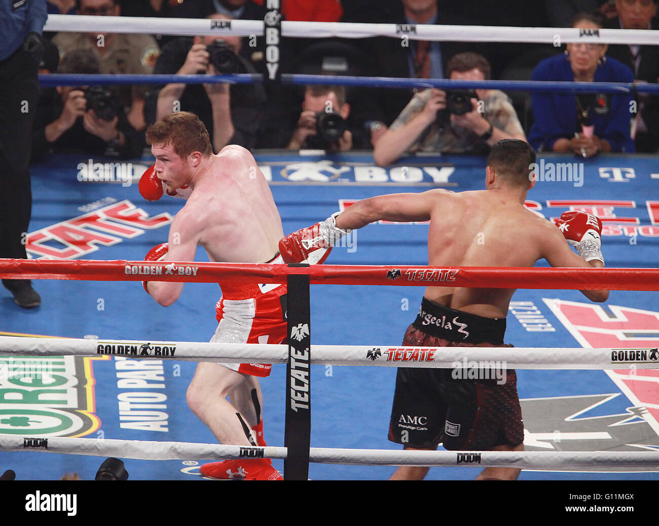 Las Vegas, Nevada, USA. 7th May, 2016. WBC Middleweight Champion Canelo Alvarez and challenger Amir Khan engage each other during their Middleweight World Championship fight on May 7, 2016, at T-Moblie Arena in Las Vegas, Nevada. Credit:  Marcel Thomas/ZUMA Wire/Alamy Live News Stock Photo