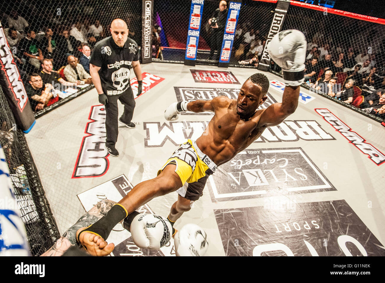 London, UK. 8th May 2016. UCMMA mixed martial arts cage fight competitors compete at the Troxy. Kris King vs Anthony Kannike in yellow shorts winner Credit:  roger parkes/Alamy Live News Stock Photo