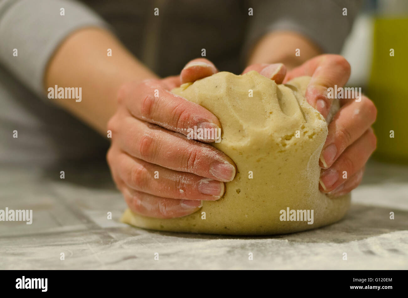 Female hands in flour closeup kneading dough Stock Photo - Alamy