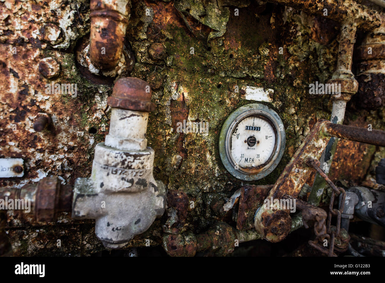 rusty peeling paint on an  old Pressure gages and operating control panel on an old mine train - clearwell caves Stock Photo