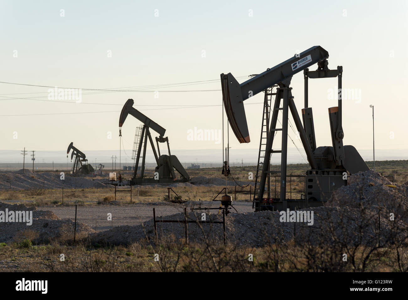 Pump jacks in an oil field in the Permian Basin, New Mexico Stock Photo
