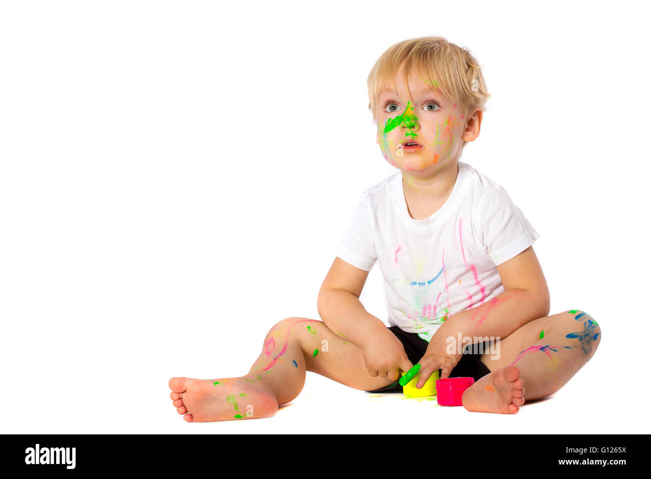 5 years old boy playing with paint, isolated on white Stock Photo Alamy