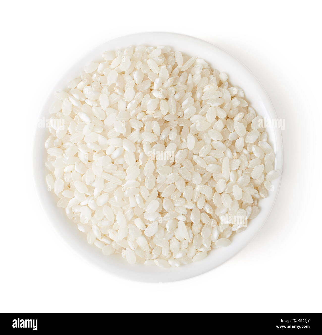 Bowl of white rice grains isolated on white background, top view Stock Photo